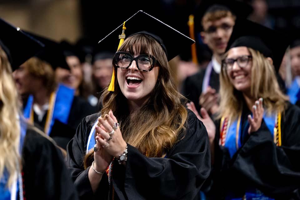 A SLU graduate cheers during commencement on Saturday, May 16, 2026. Photo by Sarah Conroy.