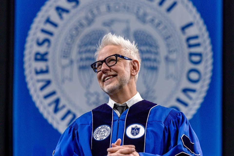 a man in a graduation gown
