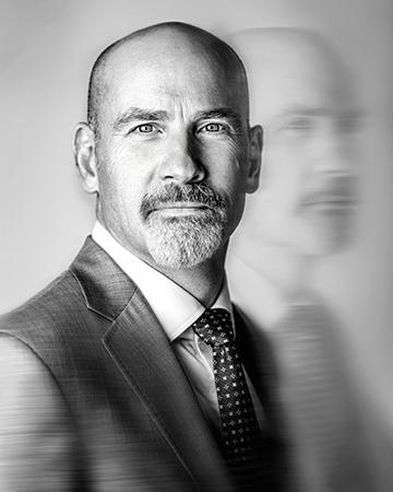 This portrait of SLU President Edward Feser, Ph.D., was recognized as the first-place portrait by the University Photographers' Association of America. Photo by Sarah Conroy.