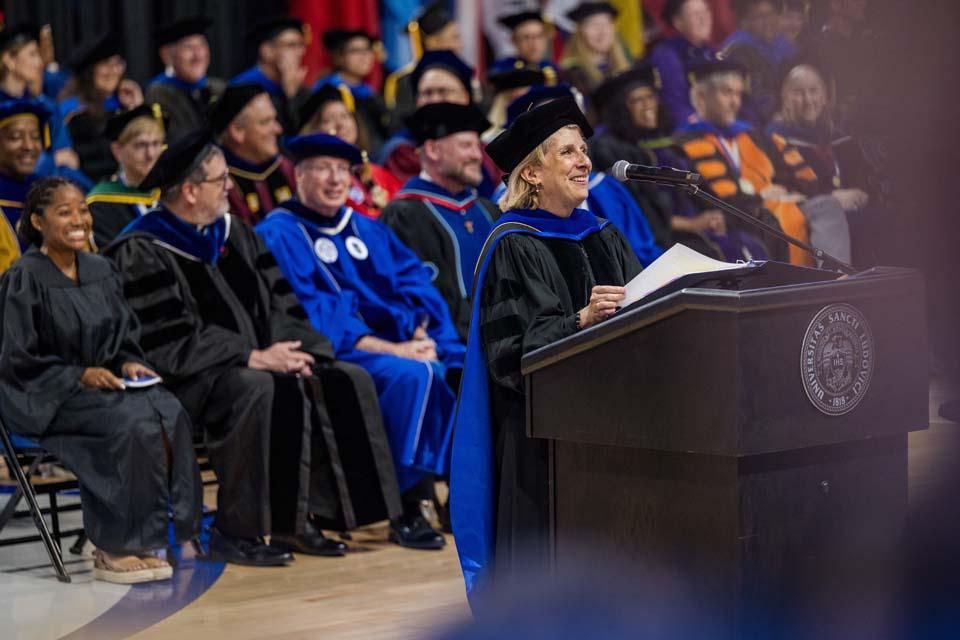 Kathy Johnson, Ph.D., executive vice president and provost, addresses new students during convocation on Aug. 18, 2026. Photo by Sarah Conroy.