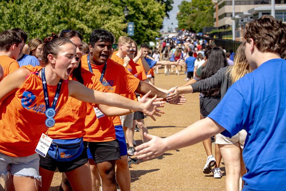 New students are cheered by Oriflamme and members of the SLU community after convocation on Aug. 18, 2026. Photo by Sarah Conroy.