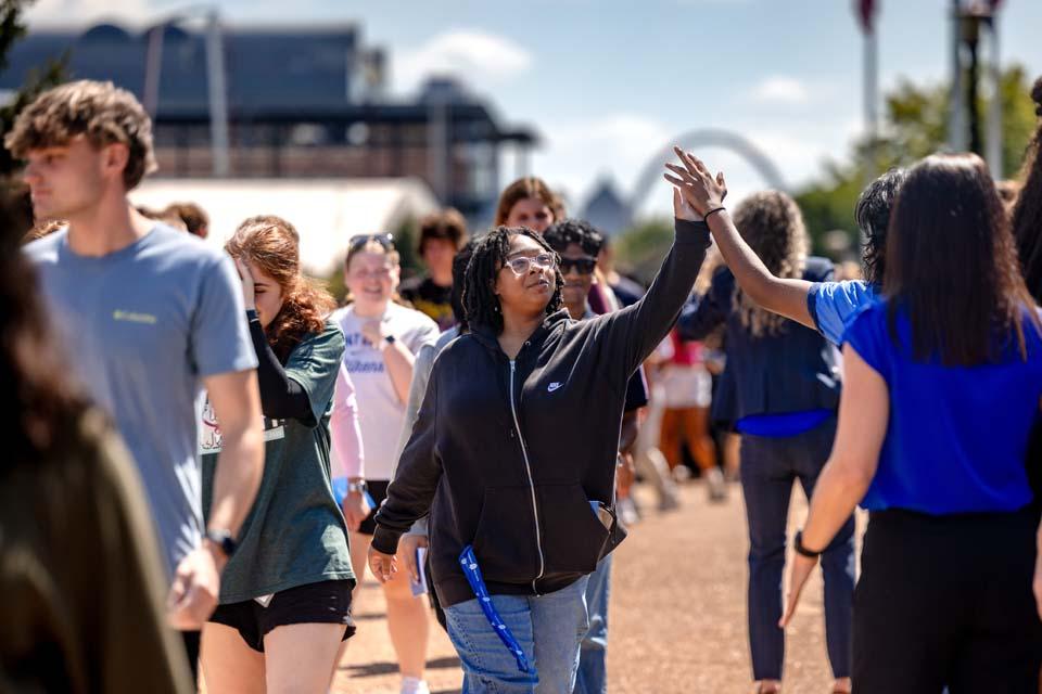 New students are cheered by members of the SLU community after convocation on Aug. 18, 2026. Photo by Sarah Conroy.