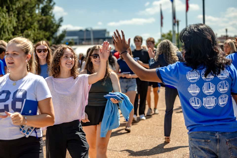 New students are cheered by members of the SLU community after convocation on Aug. 18, 2026. Photo by Sarah Conroy.