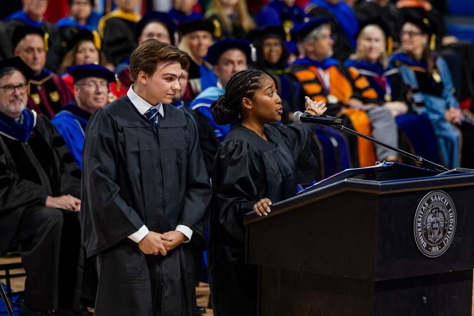 Mason Bader and Naiyah Taylor speak during convocation on Tuesday, Aug. 18. Photo by Sarah Conroy.