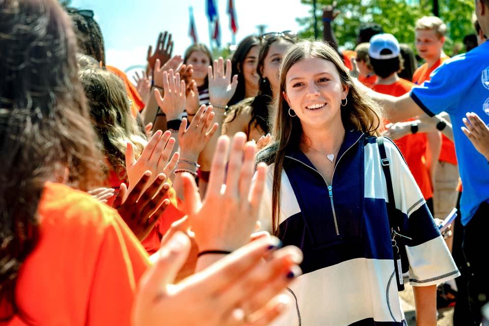New students are cheered by Oriflamme and members of the SLU community after convocation on Aug. 18, 2026. Photo by Sarah Conroy.
