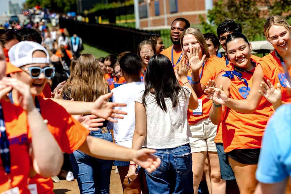 New students are cheered by members of the SLU community after convocation on Aug. 18, 2026. Photo by Sarah Conroy.