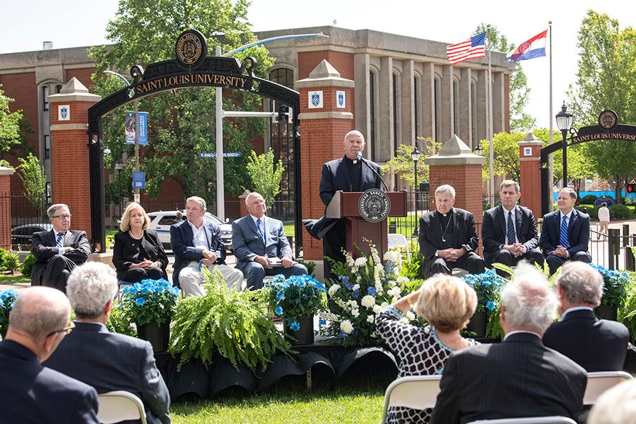 Biondi addressing the crowd Biondi at the May 22, 2019, event renaming the stretch of Grand Boulevard that fronts SLU’s campus was honorarily renamed “Father Biondi, S.J. Way.” Stage party (from left): SLU Trustee Chairman Joseph Conran, St. Louis Mayor Lyda Krewson, August A. Busch III, Trustee Emeritus Aloys H. Litteken, St. Louis Archbishop Robert J. Carlson SLU Madrid Director and Dean Paul Vita and former St. Louis Mayor Francis Slay.