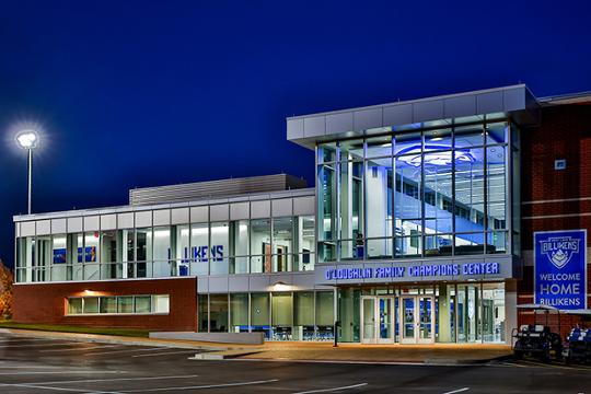 Exterior of O'Loughlin Family Champions Center, building front is a glass and steel