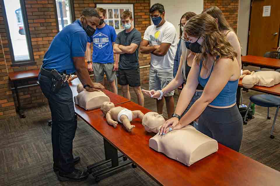 A DPS officer conducting CPR training