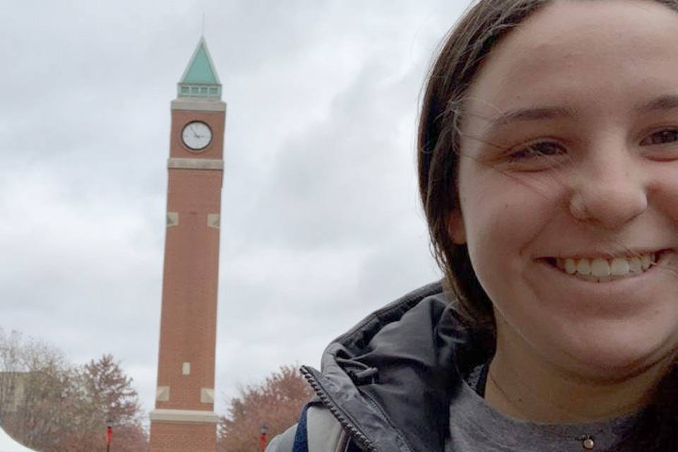 SLU student taking a SLU clocktower selfie