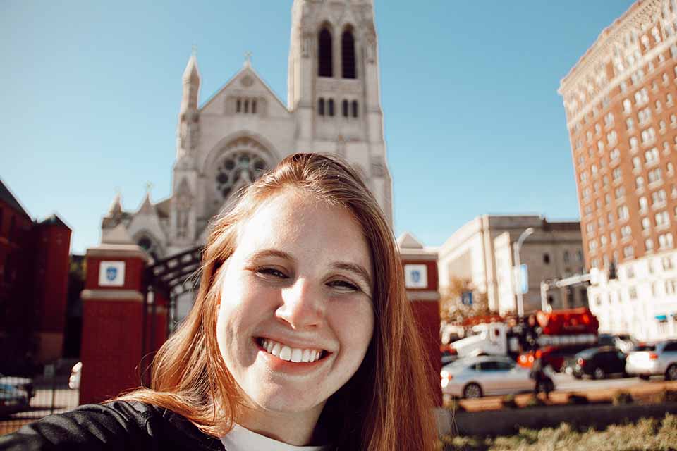 SLU student taking a College Church Selfie