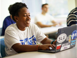 SLU student with laptop