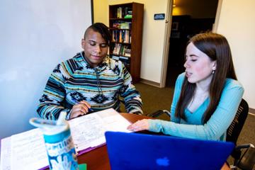 Student tutor works with a student at the Student Success Center