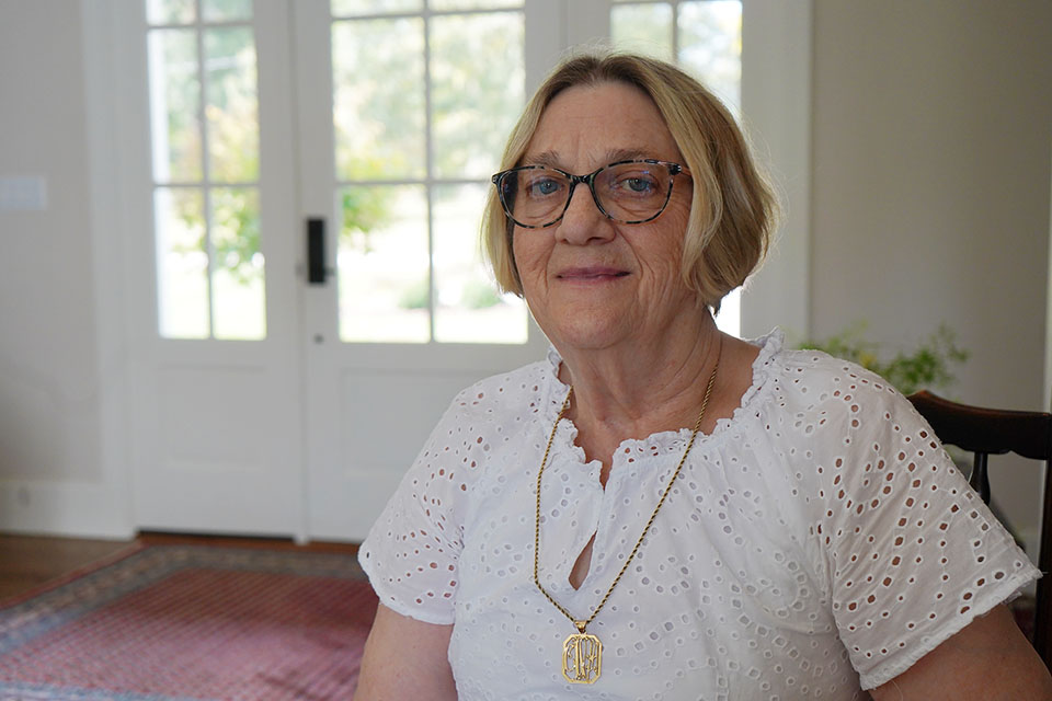 A photo of Carolyn “Carrie” Sherman in her home.