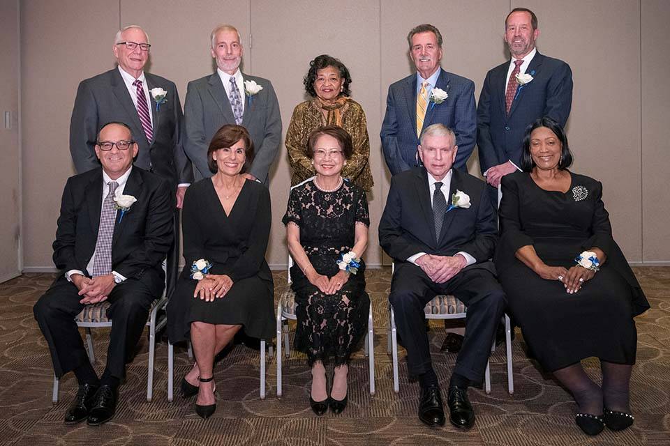 10 of SLU's 2022 Alumni Merit Award winners pose for a group photo.