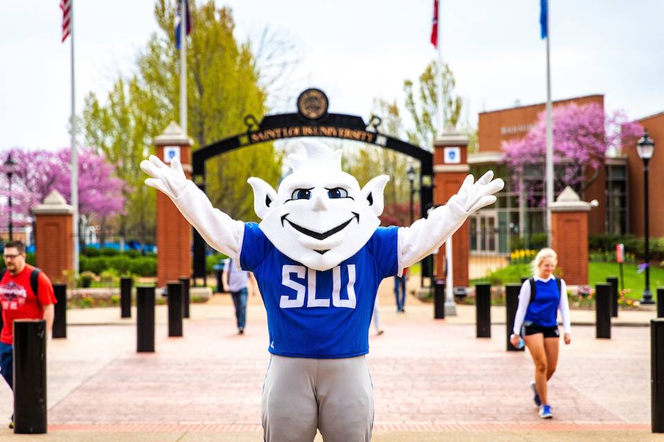 The Billiken taking a selfie with students along Grand Boulevard.