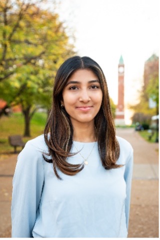 Sudeepti Nareddy stands in front of the SLU clock tower
