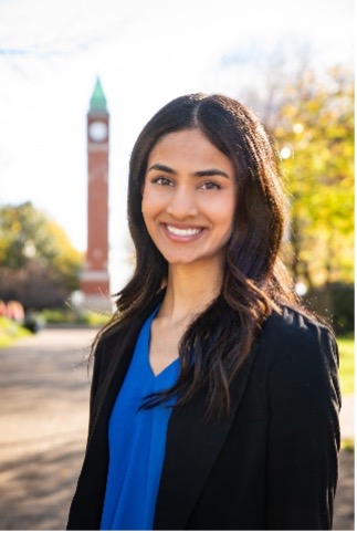 Tanvi Yadlapalli stands in front of the SLU clock tower
