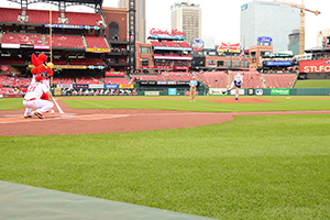The Billiken pitches to Fredbird at Busch Stadium.
