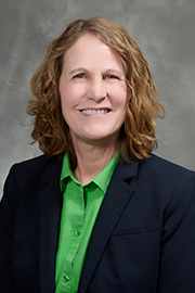 A headshot photo of Lynn Schallom