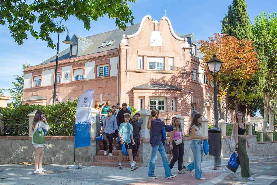 Students walk out of a building on SLU's Madrid campus.