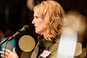 Shelli Avenevoli speaks at a podium.