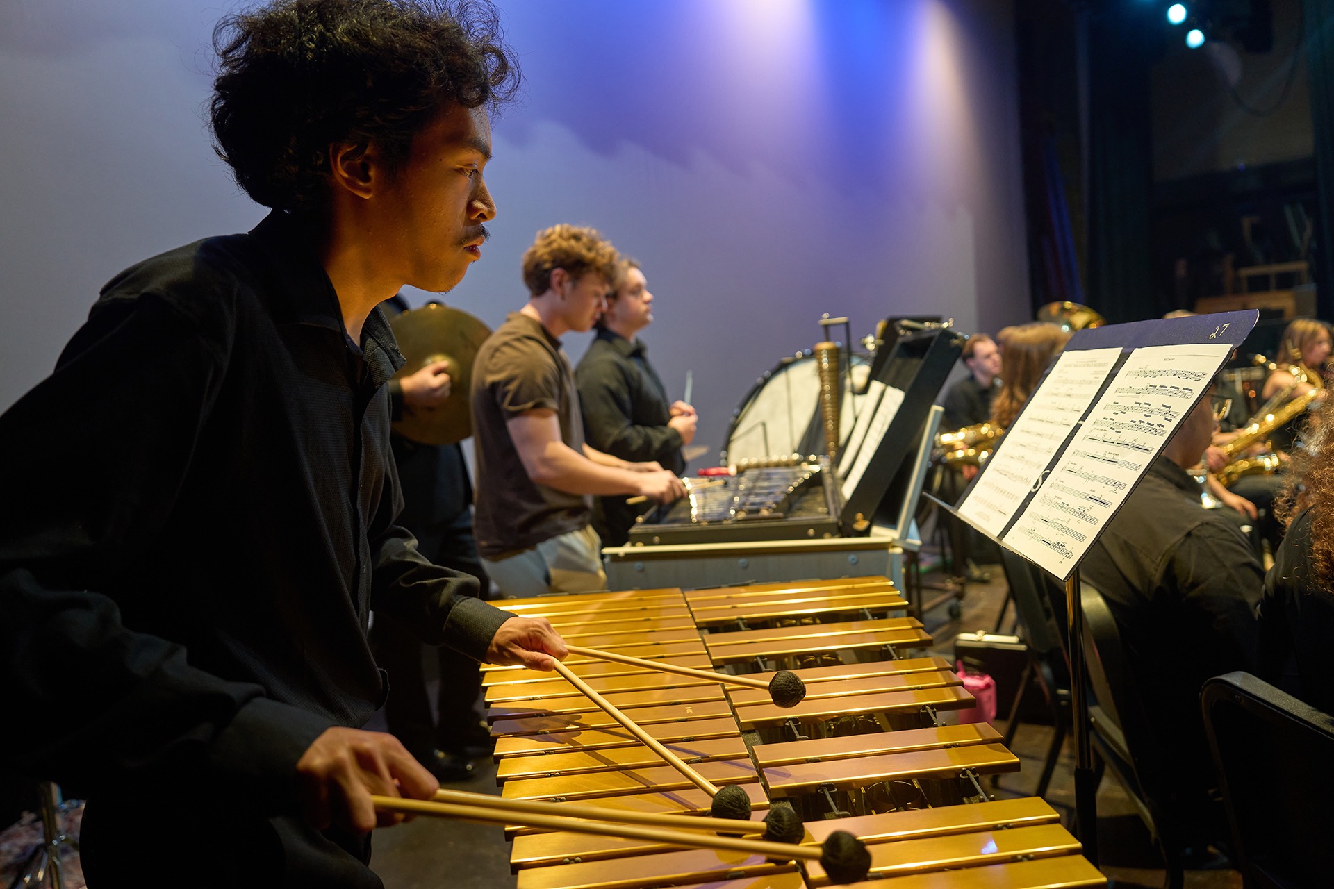 Male percussionist performing at a concert Male percussionist performing at a concert