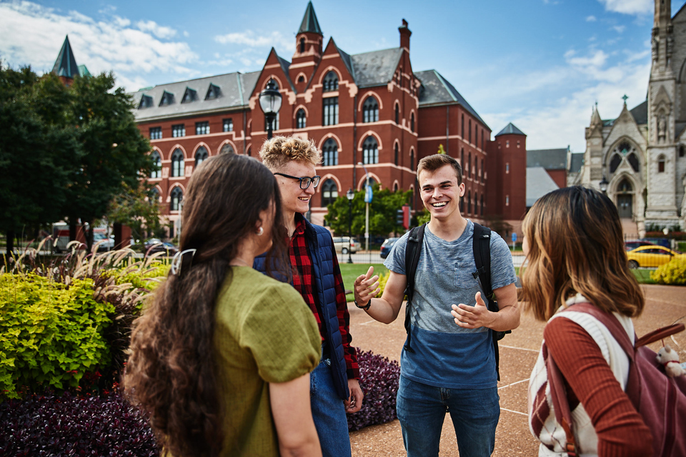 Michael and Friends in front of DuBourg Hall