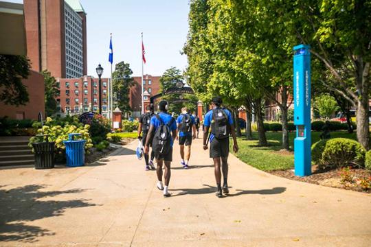 Students walking oudoors on College Campus