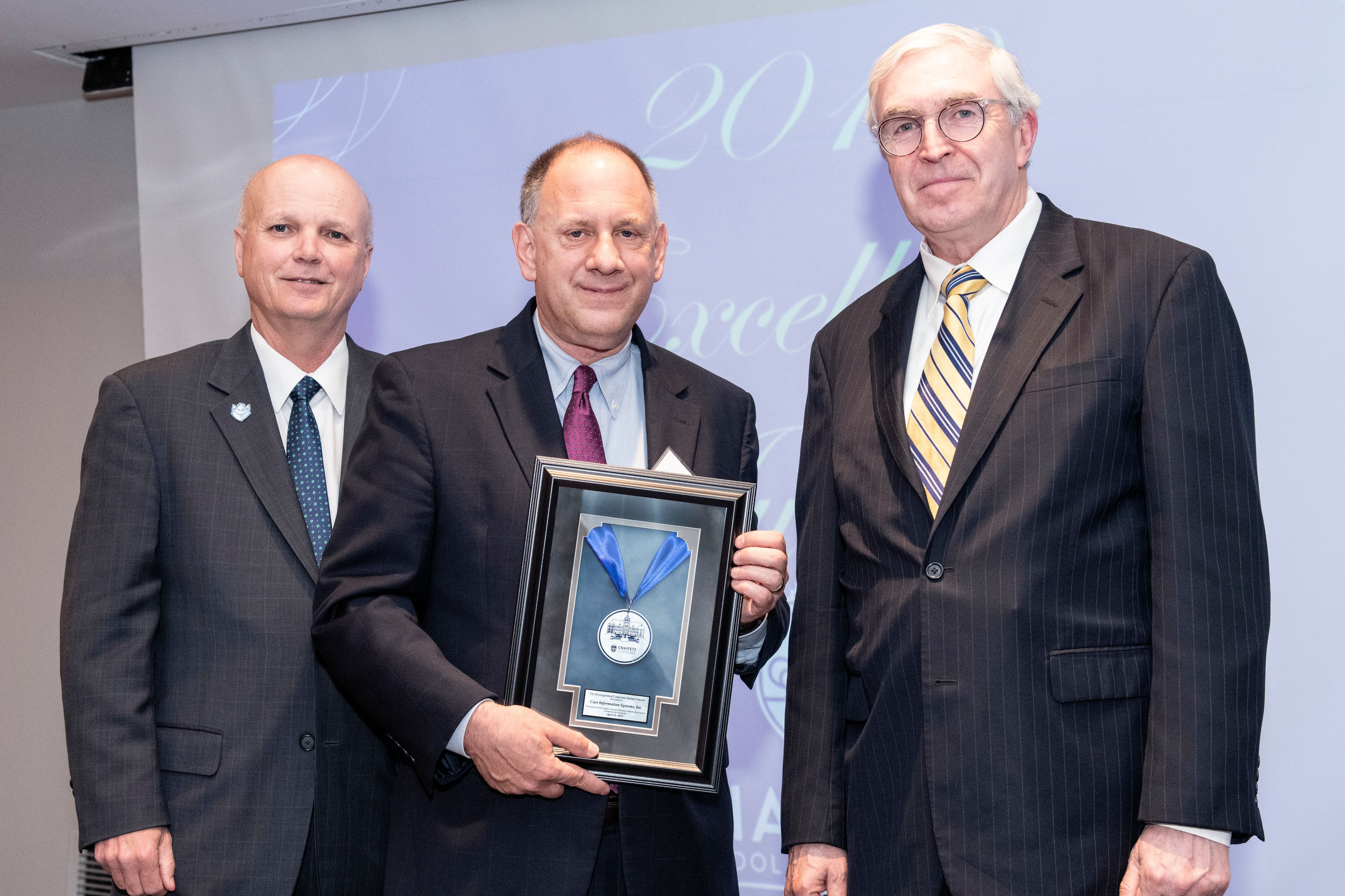 Mark Higgins (Edward Jones Dean of the Chaifetz School of Business)and Eric Brunngraber (CEO of Cass Information Systems, Inc.).