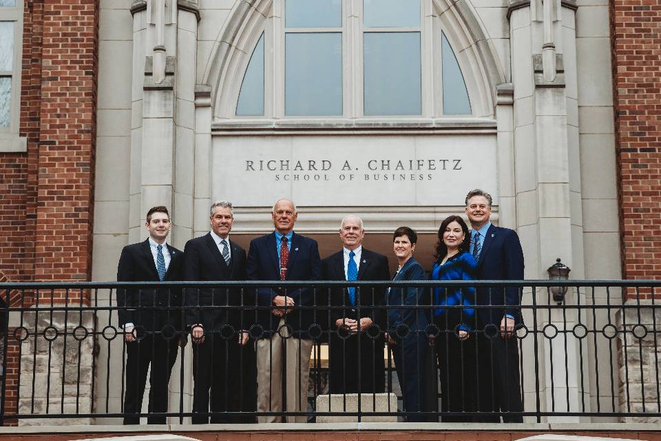 From left to right: (Left to right) Luke Miller, B.S. in Information Technology Management ‘19, Gregory Miller, B.S. in Marketing ‘88, Joseph Miller, B.S. in Marketing ’63, MBA ‘68, George Miller, B.A. in History, ’62, JD ‘65, Niki Stillwell-Miller, B.A. in English ’88, JD ‘91, Amy Miller, MD ‘96, Paul Miller, B.S. in Finance ’90, MBA ‘92