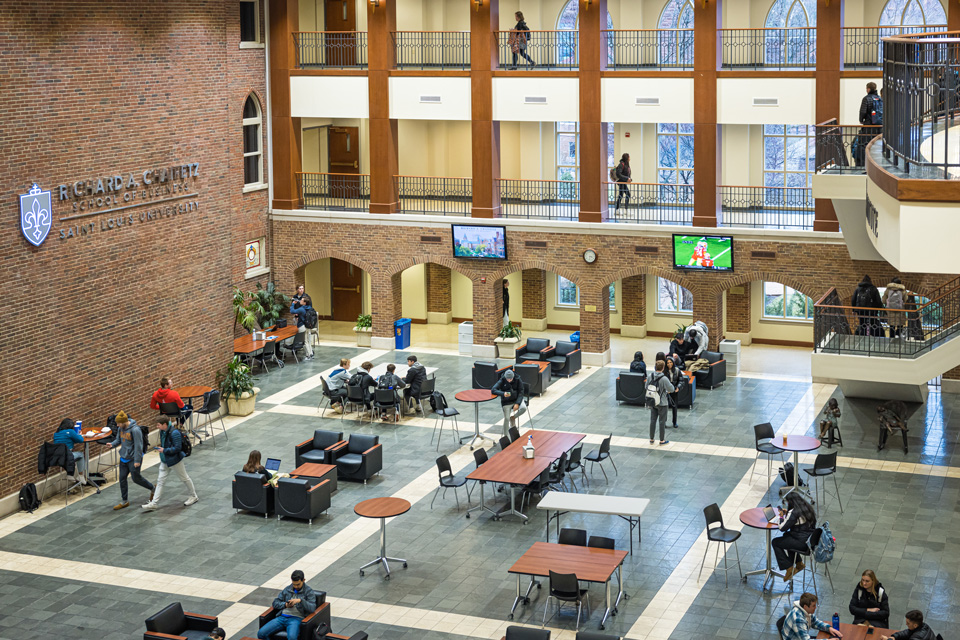 Students gather and work in the Cook Hall Atrium