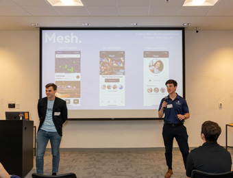 Two Saint Louis University students walked away with the Audience Choice Award and a cash prize at a local entrepreneurship contest last week when they pitched their mobile app that helps users have new experiences and find new friends in their area.