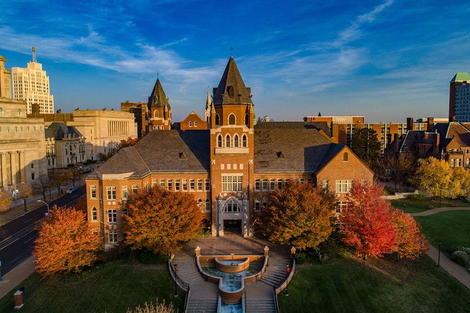 An east-facing aerial photo of Cook Hall in evening light in autumn.