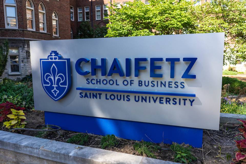 A sign marking Chaifetz School of Business outside of Cook Hall on SLU's north campus.