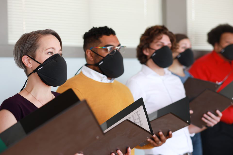 Singers wearing the new Vocal Ease mask.