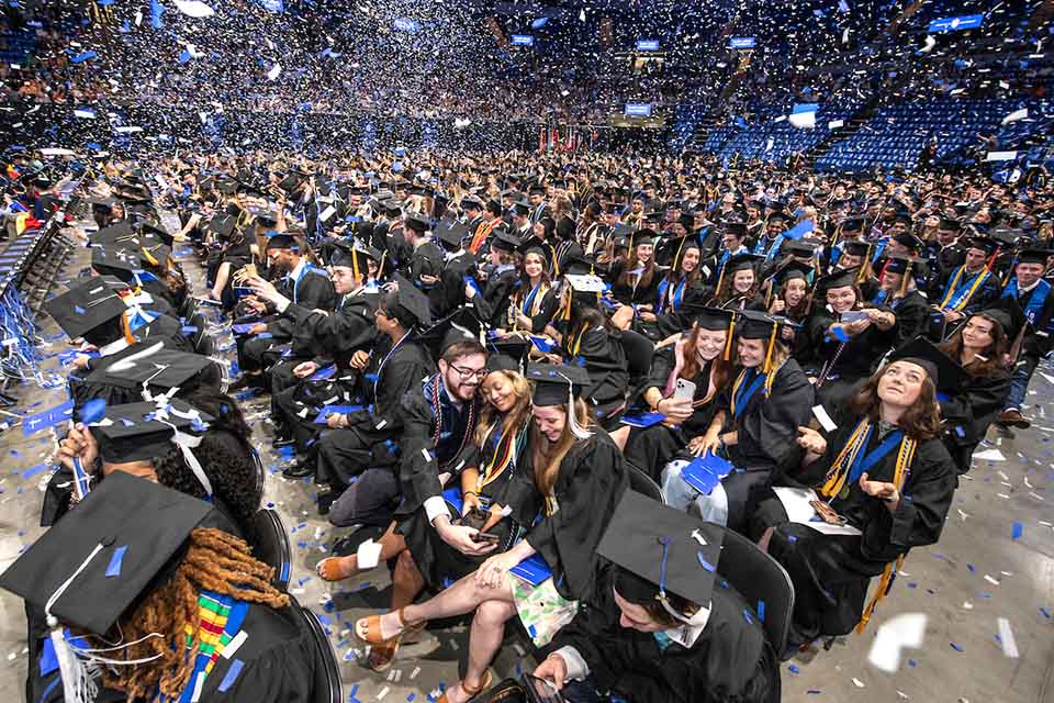 A crowd of graduates in caps and gowns