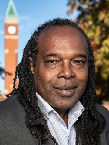 Jonathan Smith Jonathan Smith Headshot with clock tower in the background.