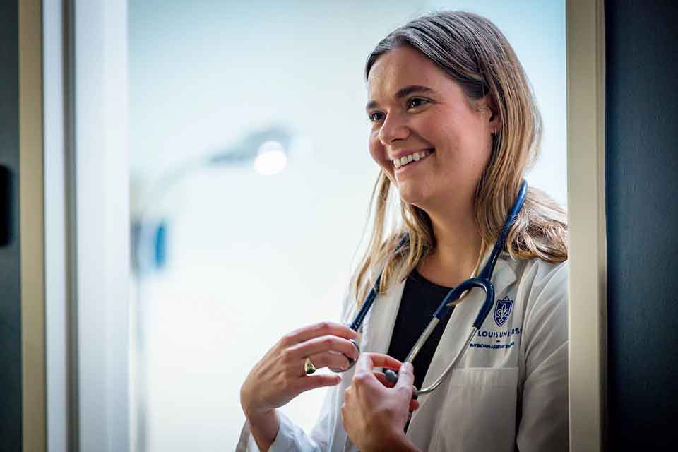 Doctor of Medical Science A PA student smiles in a SLU lab