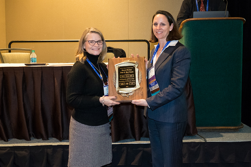 Julie Howe receiving John R. Hunt Award