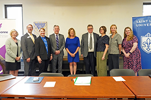 A group of Center for Bosnian Studies, Saint Louis University and Fontbonne University staff pose for a photo.