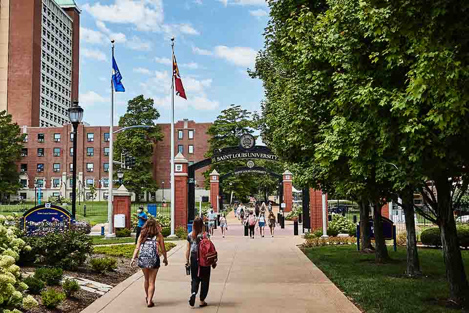 Saint Louis University's campus with students walking toward Grand Ave.