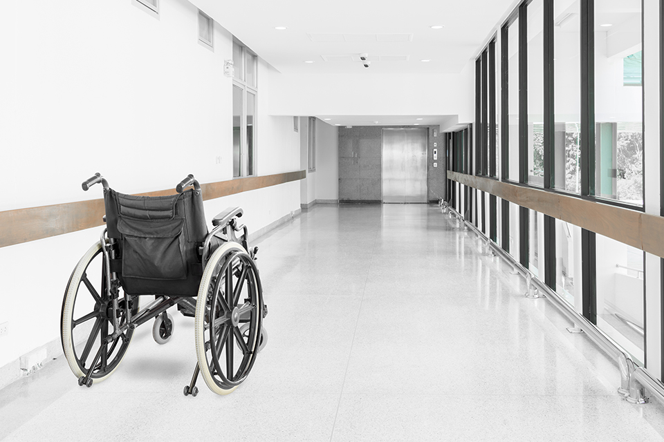 Empty wheel chair in the hallway of a health care facility