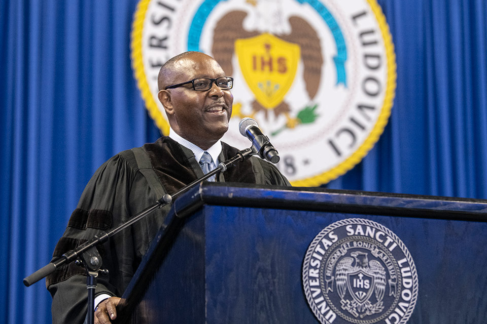 The Hon. Donald Wilkerson ('93) addresses the newly hooded graduates.