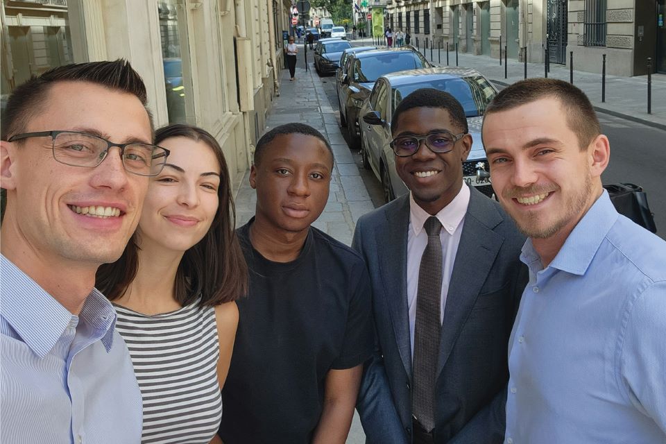 law students pose on the streets of Paris, France, where they are doing a legal internship.