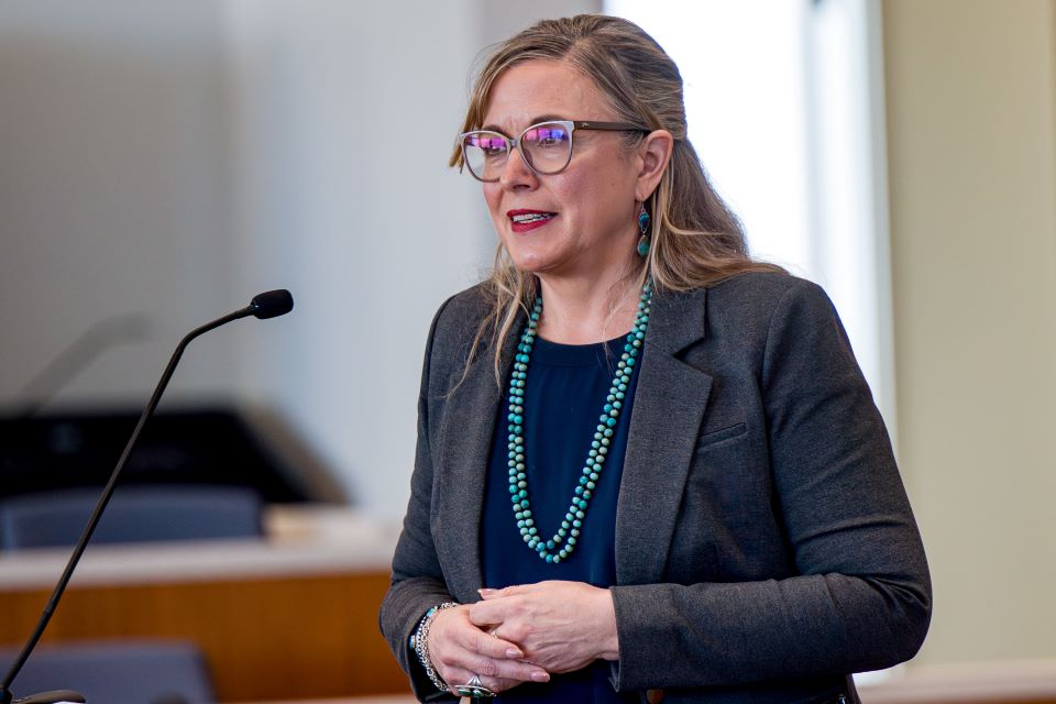 kelly gillespie speaks at a podium for the center for health law studies annual symposium held in the courtroom at scott hall kelly gillespie speaks at the center for health law studies symposium in scott hall