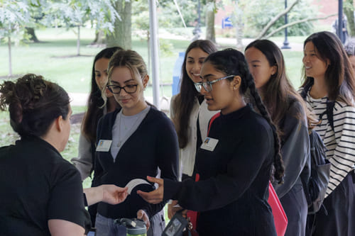 Students talking to an employer
