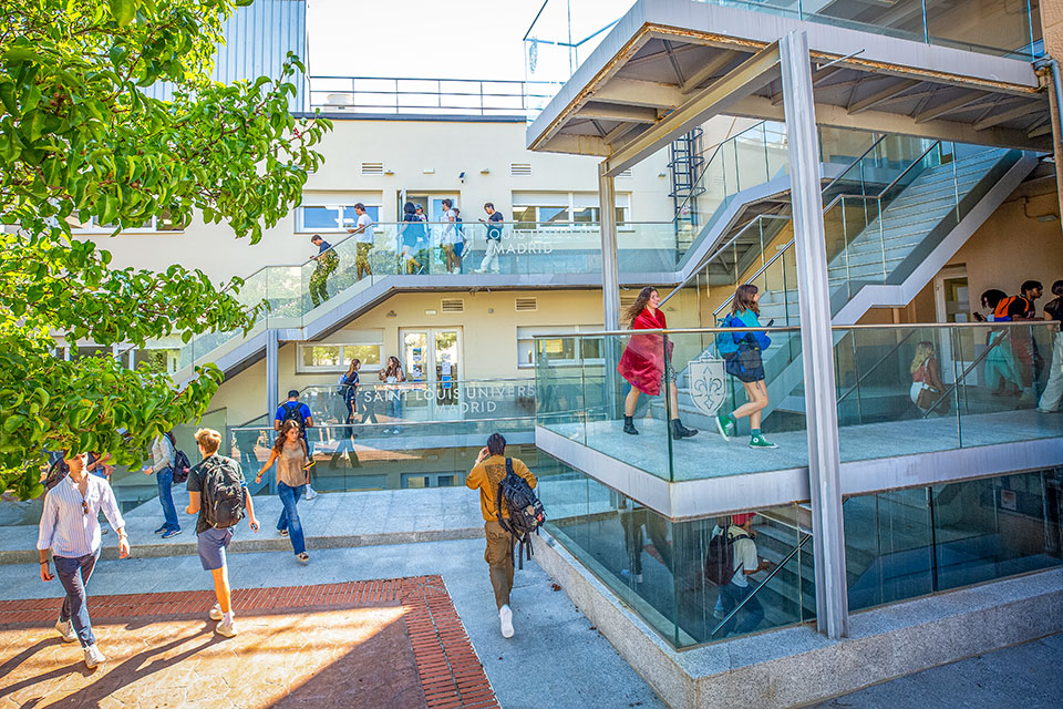 Students at SLU-Madrid's Padre Rubio Hall patio