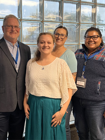 Elisabeth Demarco standing with Leslie Hinyard, Jeffrey Scherrer, and Divya Subraminum Elisabeth Demarco standing with Leslie Hinyard, Jeffrey Scherrer, and Divya Subraminum