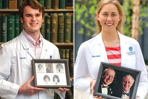 Two medical students holding pictures of their family members that previously attended SLU SOM